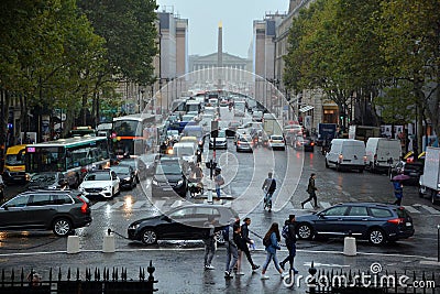 Street scene of Paris with Eglise de la Madeleine. Editorial Stock Photo