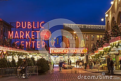 Street scene of Pike Place Market at Christmas with tourists and holiday decorations, Seattle, Washington, United States Editorial Stock Photo