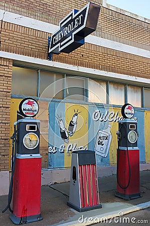 A Street Scene of Vintage Signs and Gas Pumps, Lowell, Arizona Editorial Stock Photo