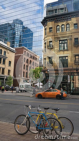 Daily street scenery in downtown Toronto with old buildings and new glass skyscrapers Editorial Stock Photo