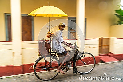 Street seller with bicycle selling sweets, Galle, South Coast Editorial Stock Photo