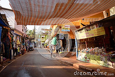 Arambol, Goa, Iindia - March 22, 2017: Street shops of sale of souvenirs and clothes for tourists in the Arambol village Editorial Stock Photo