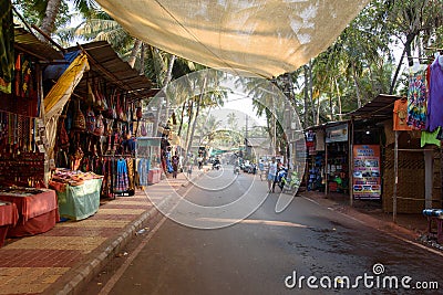 Arambol, Goa, Iindia - March 22, 2017: Street shops of sale of souvenirs and clothes for tourists in the Arambol village Editorial Stock Photo