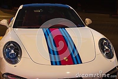 Street shot of a modern sports car Martini racing Porsche 911 in Vancouver Canada. Front view with headlights Editorial Stock Photo