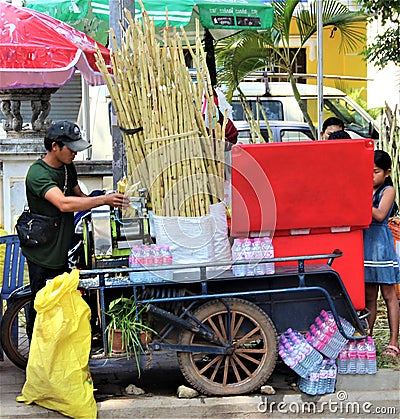 Street side sugar cane juice seller and mobile stall in asia Editorial Stock Photo
