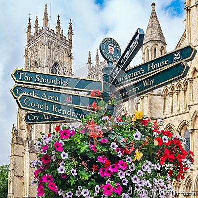 The York Minster and a sign with directions to landmarks in the city Editorial Stock Photo