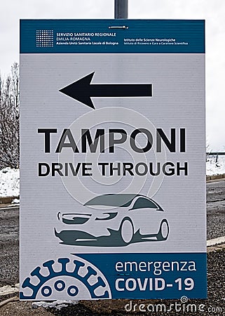 Street sign: molecular swab test, drive through. Covid-19 emergency. Italian National Health Service, Emilia-Romagna Region Editorial Stock Photo