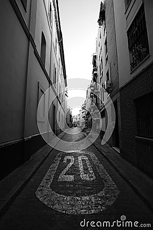 a street sign on pavement on a small street Editorial Stock Photo