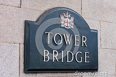 Street sign Tower Bridge on wall in City of London, England. Editorial Stock Photo