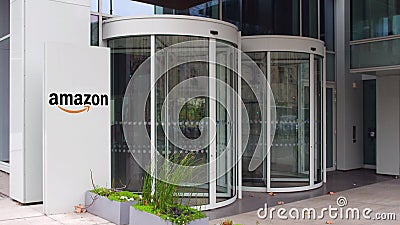 Street signage board with Amazon.com logo. Modern office building. Editorial 3D rendering Editorial Stock Photo