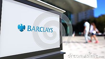 Street signage board with Barclays logo. Blurred office center and walking people background. Editorial 3D rendering Editorial Stock Photo