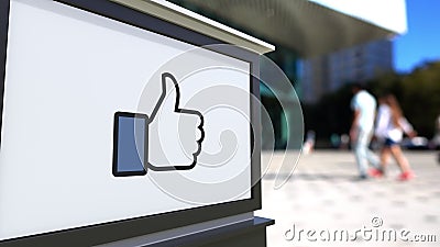 Street signage board with Facebook like button thumb up Editorial Stock Photo