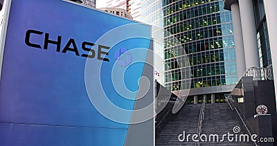 Street signage board with JPMorgan Chase Bank logo. Modern office center skyscraper and stairs background. Editorial 3D Editorial Stock Photo