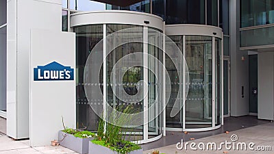 Street signage board with Lowe`s logo. Modern office building. Editorial 3D rendering Editorial Stock Photo