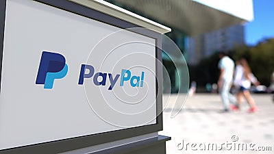 Street signage board with PayPal logo. Blurred office center and walking people background. Editorial 3D rendering Editorial Stock Photo