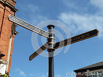 Street signpost, Citizen`s Advice, Baptist Church Editorial Stock Photo