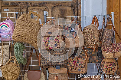 Street souvenirs market in Peniscola with traditional bags, Spain Editorial Stock Photo