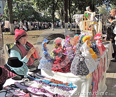 Street stand saleswoman of souvenir dolls Editorial Stock Photo