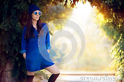 Street Style Fashion Girl Wearing a Blue Denim Romper Stock Photo