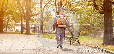 Street sweeper collects leaves from the fan motor Editorial Stock Photo