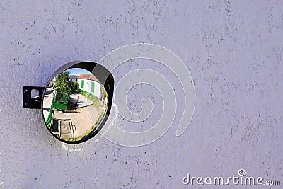 Street traffic wall convex mirror in road safety concept in city center Stock Photo