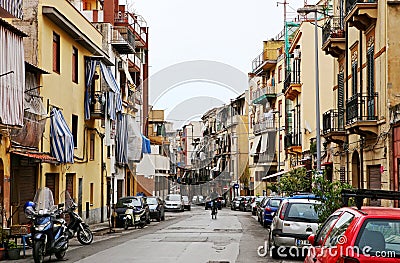 Street with typical Italian apartment buildings and shops in Palermo Editorial Stock Photo