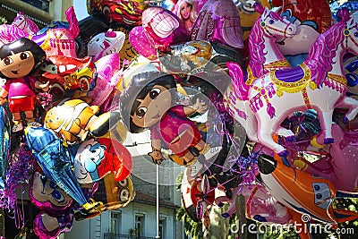Street vending colorful cartoon foil balloonss depicting cartoo Editorial Stock Photo