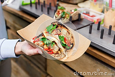 Street vendor hands making taco outdoors Stock Photo