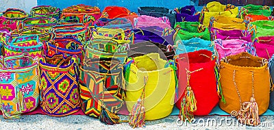 Street vendor selling craft bags in Cartagena, Colombia Stock Photo