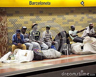 Street Vendors with large bales are waiting for a train in the subway Editorial Stock Photo