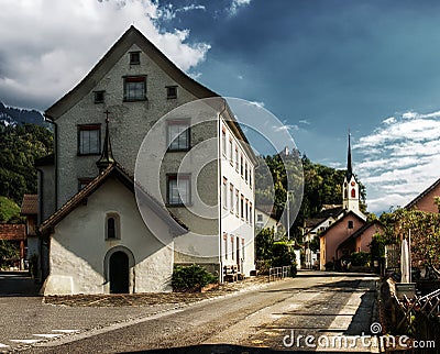 Street view of alpine village showing three chapels Editorial Stock Photo