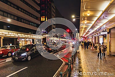 Street view with busy traffic, downtown of Kyoto, Japan, at night Editorial Stock Photo