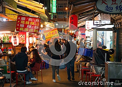 Street view of Raohe Street food Night Market full of people in Taipei Taiwan Editorial Stock Photo