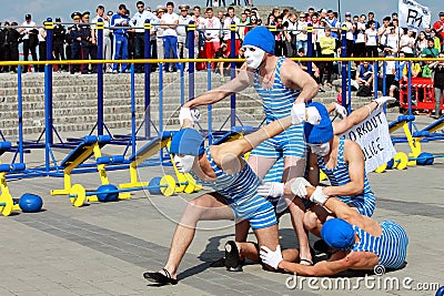 Street workout, model appearances of group of sportsmen in masks in Dnepropetrovsk. Editorial Stock Photo