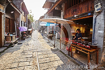 Street of the Xingping Ancient Town at sunset. Editorial Stock Photo