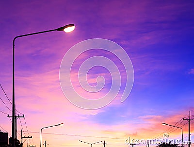Streetlight with highlight on fantasy sky background and pink clouds after sunset Stock Photo