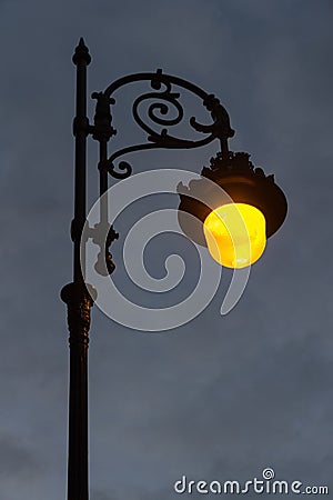 Streetlight Lit at Dawn Stock Photo