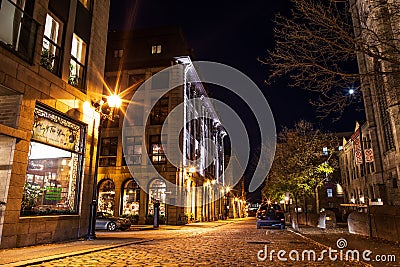Streets and historical buildings in the historic site of Old Port from Montreal, night view. Old urban architecture of Montreal Editorial Stock Photo