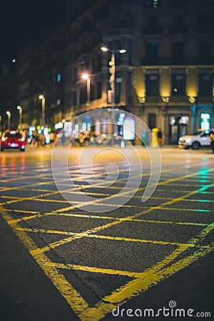 Streets intersection painted in yellow in the city during night Stock Photo