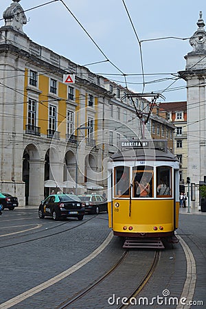 Streets of Lisbon. Yellow tram. Old Portugal. Visit Portugal. Old Europe. Ruas de Lisboa. ElÃ©ctrico amarelo. Editorial Stock Photo