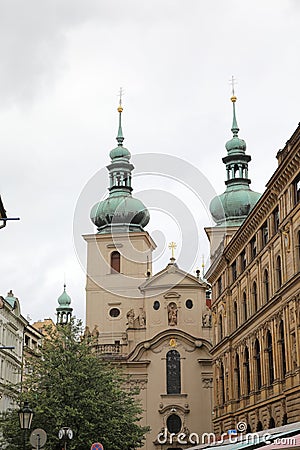 Streets of old Prague with all numerous little shops and crowds of the tourists who are looking for new impressions. Stock Photo