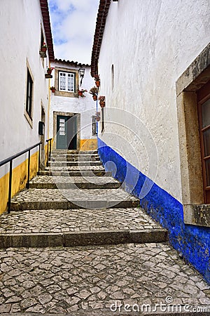 In the streets of the picturesque town of Obidos, Portugal Stock Photo