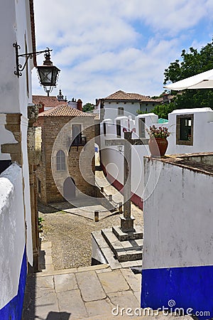 In the streets of the picturesque town of Obidos, Portugal Stock Photo