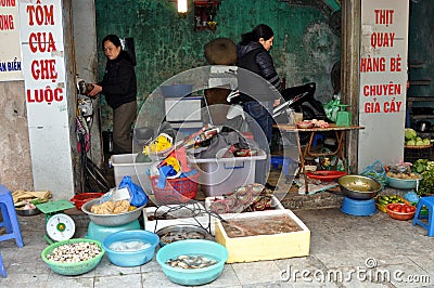 Streets of Vietnam - Fish sellers on the sidewalk Editorial Stock Photo