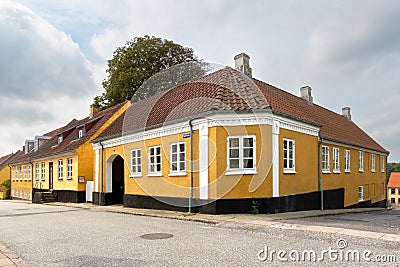 Streetscene of Sondergade with yellow houses in Hobro, Nordjylland, Denmark Stock Photo