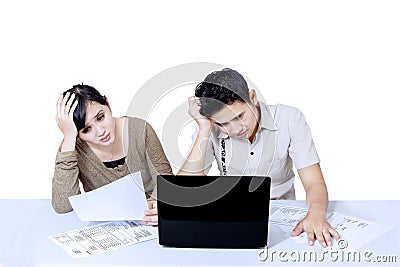 Stress couple paying bills online - isolated Stock Photo