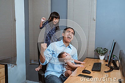 Stress father working from home Stock Photo