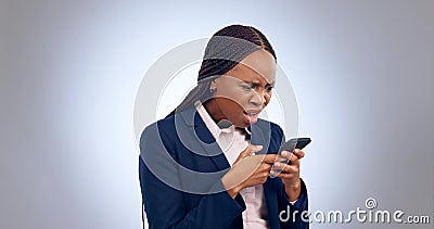 Stress, phone and confused black woman frustrated by text in studio with fake news, review or feedback on grey Stock Photo