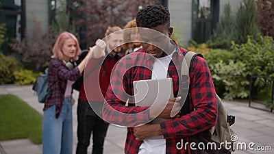 Stressed African American school guy male student bullied man suffer with racism discrimination bullying multiracial Stock Photo