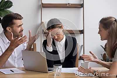 Stressed annoyed office employee having headache migraine at business meeting Stock Photo